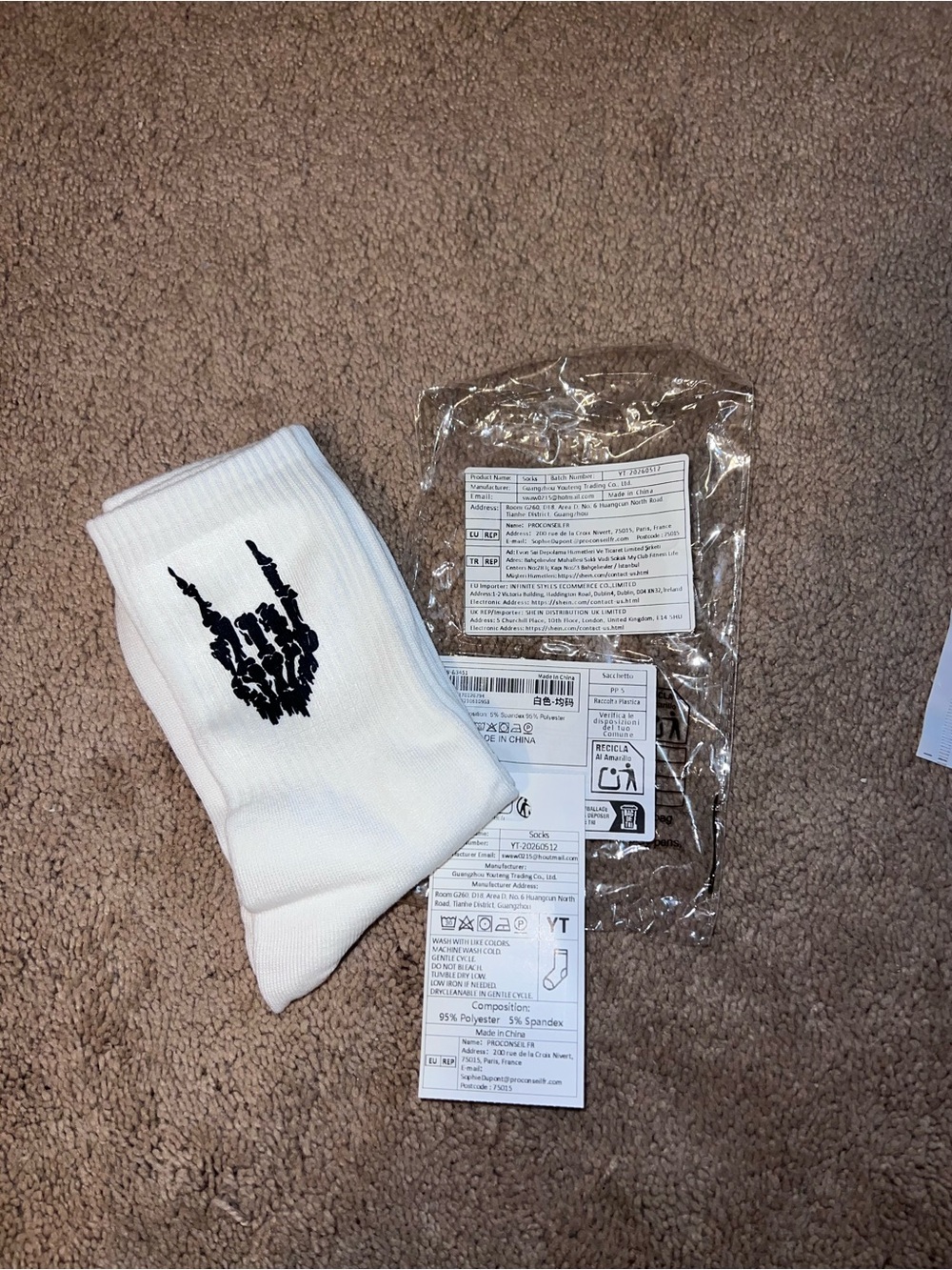 White Crew Socks with Black Skeleton Hand Logo